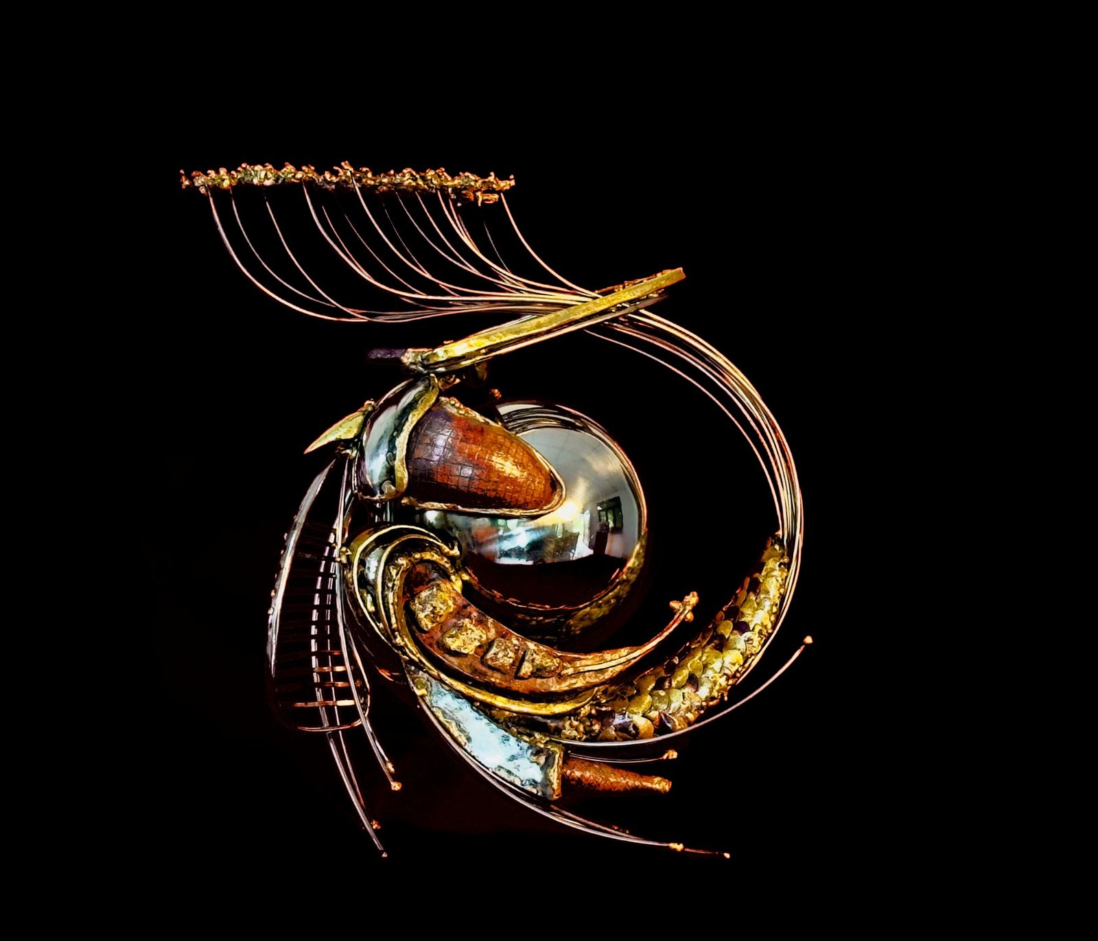 Apigustia: a steel sphere held by textured copper forms under a crown of rods